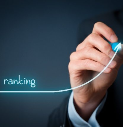 A picture of a male’s hand drawing a blue line curving upward. “Ranking” is printed above the line.