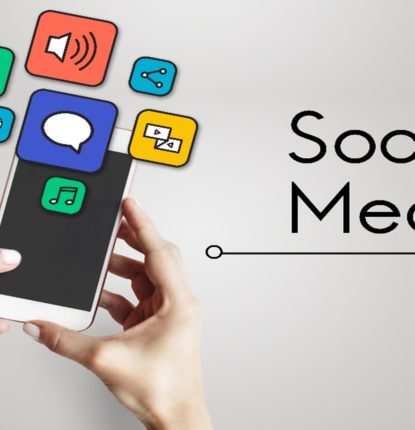 Two hands holding a phone with several icons popping off of the screen with “social media” written next to it.