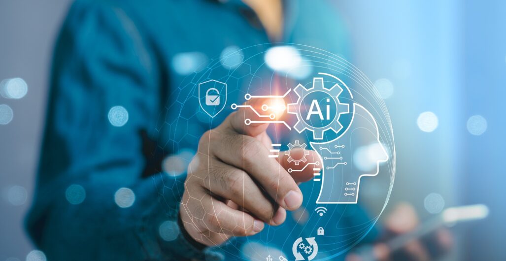 A man holding a smartphone in one hand reaches out with the other to tap a screen in front of him with an AI icon and other digital icons on it.