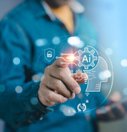 A man holding a smartphone in one hand reaches out with the other to tap a screen in front of him with an AI icon and other digital icons on it.