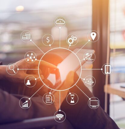 A business person holding a tablet with a white circle over it that is the center of several other circles that represent multichannel marketing.