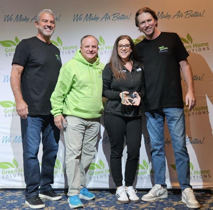 The Green Home Solutions Franchise team with Angela Dowdell accepting the Vendor of the Year award. 