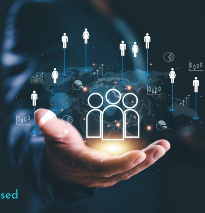 An outstretched hand with an icon of people and business growth hovering above the hand with the words “Customer Obsessed” at the bottom.